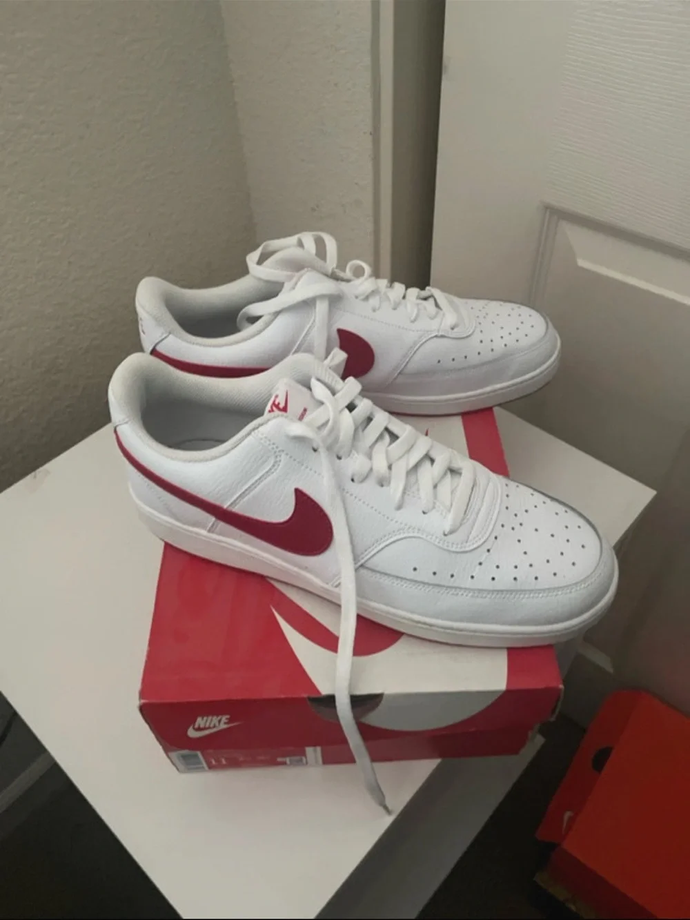 Nike White Low-Top Sneakers with Red Swoosh